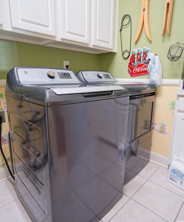 530 Inverarry St, Murrells Inlet, SC 29576 - laundry room with washing machine and dryer, cabinet space, and light tile patterned floors