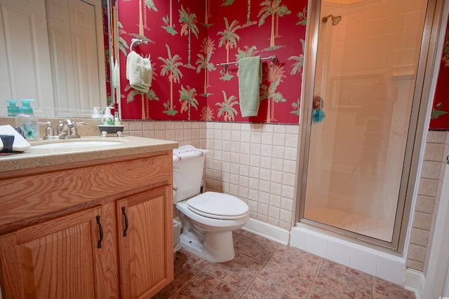 530 Inverarry St, Murrells Inlet, SC 29576 - full bathroom featuring a stall shower, vanity, tile patterned flooring, a wainscoted wall, and tile walls
