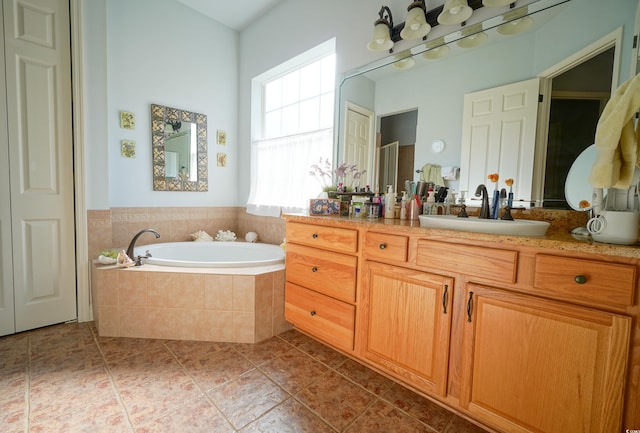 530 Inverarry St, Murrells Inlet, SC 29576 - full bathroom featuring a garden tub, vanity, and tile patterned floors