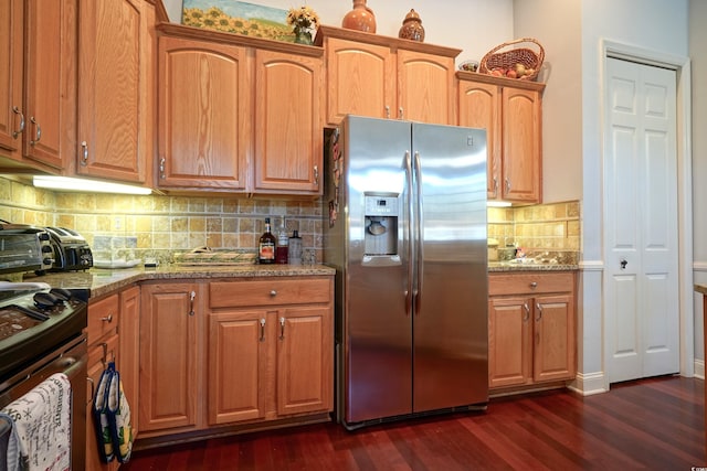 530 Inverarry St, Murrells Inlet, SC 29576 - kitchen with appliances with stainless steel finishes, dark wood-style floors, light stone countertops, and decorative backsplash