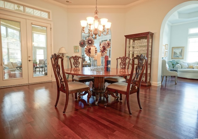 530 Inverarry St, Murrells Inlet, SC 29576 - dining area featuring french doors, arched walkways, wood finished floors, ornamental molding, and a chandelier