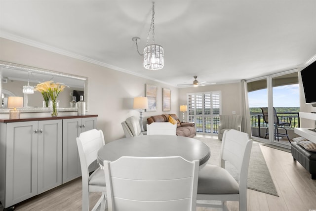 1819 N Ocean Blvd Unit 1518, North Myrtle Beach, SC 29582 - dining space with a ceiling fan, light wood-style floors, crown molding, and a chandelier