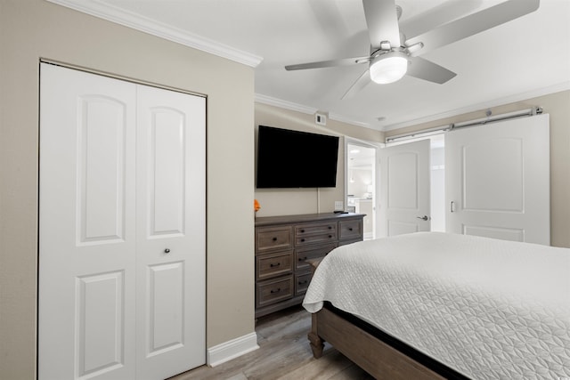 1819 N Ocean Blvd Unit 1518, North Myrtle Beach, SC 29582 - bedroom featuring ornamental molding, light wood finished floors, a closet, and a ceiling fan