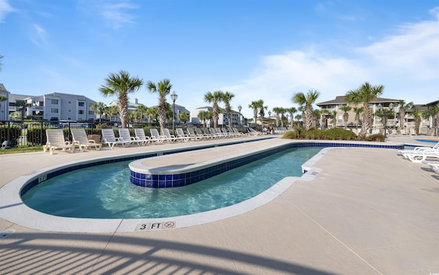 1819 N Ocean Blvd Unit 1518, North Myrtle Beach, SC 29582 - community pool featuring a residential view, a patio area, and a jacuzzi