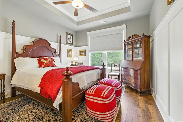 175 Chapel Creek Rd, Pawleys Island, SC 29585 - bedroom featuring a raised ceiling, hardwood / wood-style floors, ornamental molding, and ceiling fan