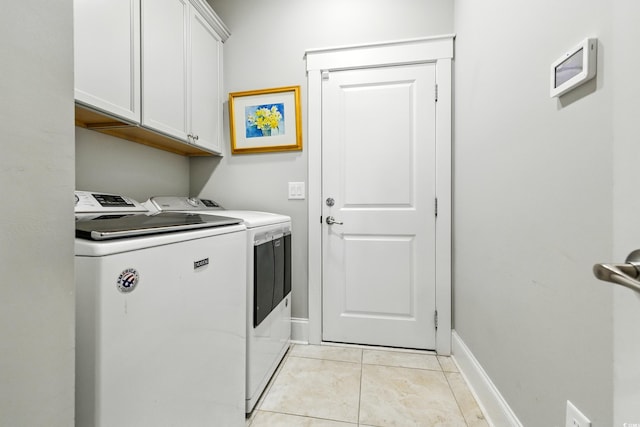 175 Chapel Creek Rd, Pawleys Island, SC 29585 - laundry room featuring washing machine and dryer, cabinet space, and light tile patterned flooring