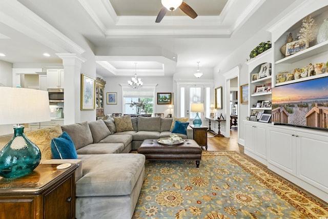 175 Chapel Creek Rd, Pawleys Island, SC 29585 - living room featuring a tray ceiling, a ceiling fan, recessed lighting, a chandelier, and wood finished floors