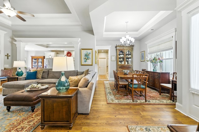 175 Chapel Creek Rd, Pawleys Island, SC 29585 - living area with a tray ceiling, wood-type flooring, ceiling fan, crown molding, and a chandelier