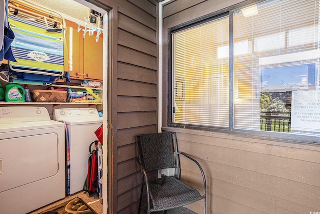 207 N Ocean Blvd Unit 139, North Myrtle Beach, SC 29582 - laundry area with cabinet space, washing machine and clothes dryer, and healthy amount of natural light