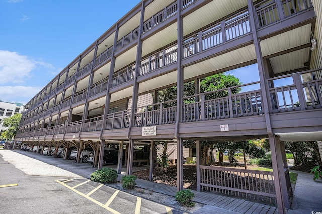 207 N Ocean Blvd Unit 139, North Myrtle Beach, SC 29582 - view of apartment building / complex featuring covered parking