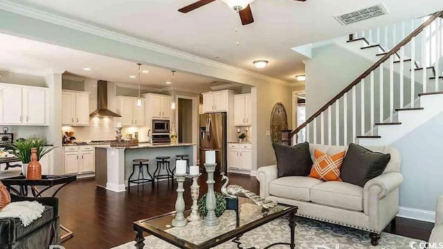 1012 Fowler Rd, Conway, SC 29526 - living area featuring a ceiling fan, dark wood-style floors, stairway, and crown molding