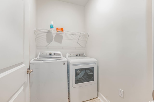 5116 Double Eagle Way Unit 49, North Myrtle Beach, SC 29582 - washroom with washer and dryer and baseboards