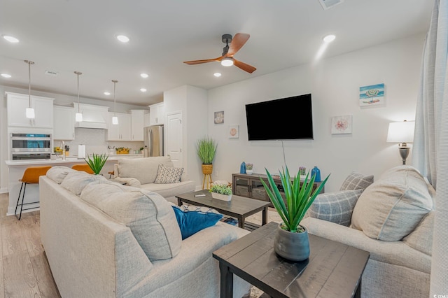 5116 Double Eagle Way Unit 49, North Myrtle Beach, SC 29582 - living room featuring light wood-type flooring, ceiling fan, and recessed lighting