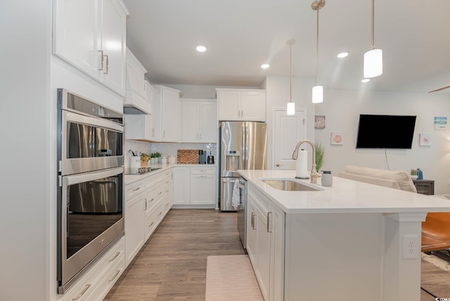 5116 Double Eagle Way Unit 49, North Myrtle Beach, SC 29582 - kitchen featuring appliances with stainless steel finishes, open floor plan, light countertops, backsplash, and white cabinets