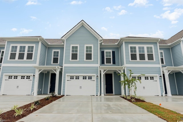 5116 Double Eagle Way Unit 49, North Myrtle Beach, SC 29582 - view of front of property with concrete driveway and a garage