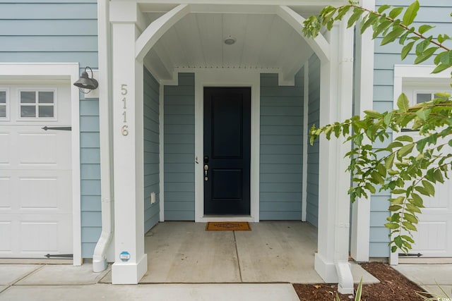 5116 Double Eagle Way Unit 49, North Myrtle Beach, SC 29582 - view of exterior entry featuring a garage