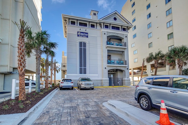5116 Double Eagle Way Unit 49, North Myrtle Beach, SC 29582 - view of building exterior with uncovered parking