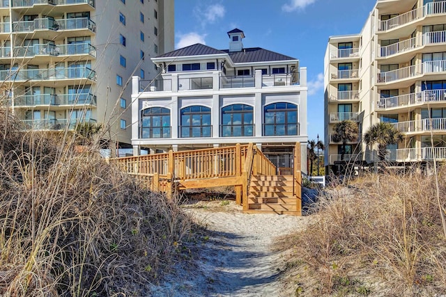 5116 Double Eagle Way Unit 49, North Myrtle Beach, SC 29582 - rear view of property featuring a metal roof and a balcony