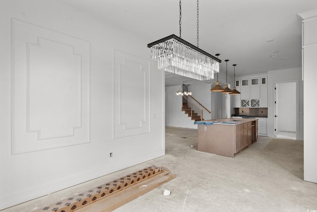 2201 Yellow Morel Way, Myrtle Beach, SC 29579 - kitchen with a center island, a chandelier, decorative light fixtures, white cabinets, and glass insert cabinets