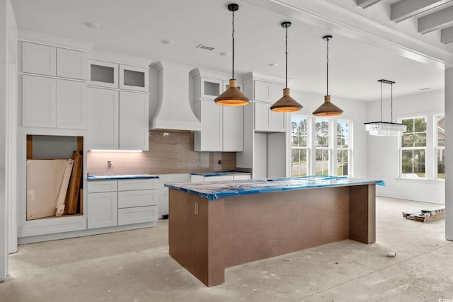 2201 Yellow Morel Way, Myrtle Beach, SC 29579 - kitchen featuring backsplash, a kitchen island, premium range hood, white cabinetry, and decorative light fixtures