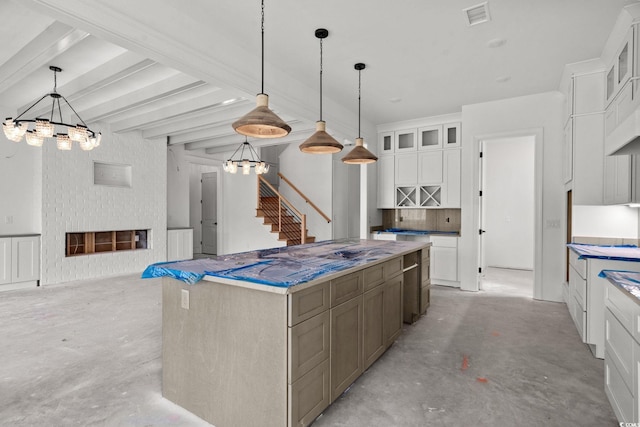 2201 Yellow Morel Way, Myrtle Beach, SC 29579 - kitchen featuring a chandelier, unfinished concrete floors, white cabinets, glass insert cabinets, and a center island