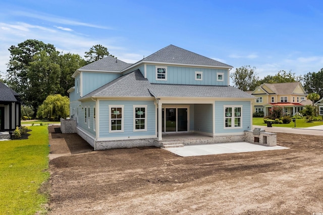 2201 Yellow Morel Way, Myrtle Beach, SC 29579 - rear view of house featuring a patio, roof with shingles, and a lawn