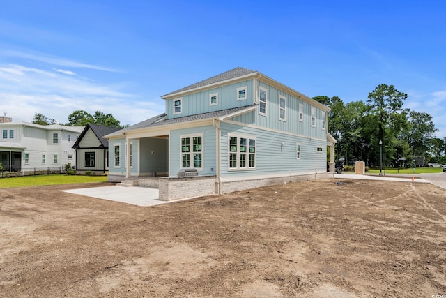 2201 Yellow Morel Way, Myrtle Beach, SC 29579 - rear view of property with board and batten siding and a patio area