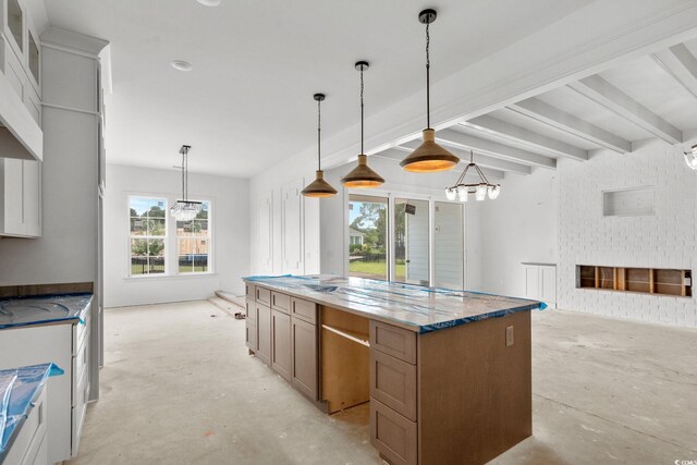 2201 Yellow Morel Way, Myrtle Beach, SC 29579 - kitchen with concrete floors, a kitchen island, open floor plan, and decorative light fixtures