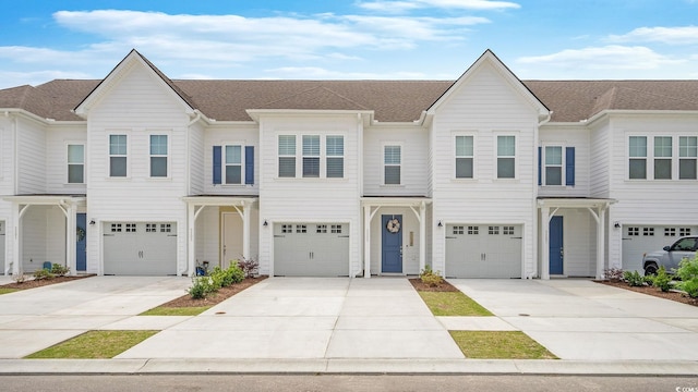 5205 Double Eagle Way Unit 24, North Myrtle Beach, SC 29582 - townhome / multi-family property with a garage, driveway, and roof with shingles
