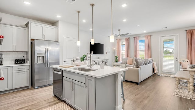 5205 Double Eagle Way Unit 24, North Myrtle Beach, SC 29582 - kitchen with stainless steel appliances, gray cabinets, light wood-type flooring, and recessed lighting