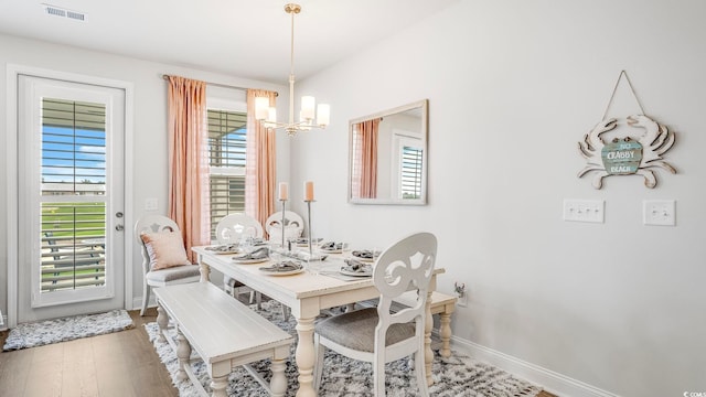5205 Double Eagle Way Unit 24, North Myrtle Beach, SC 29582 - dining area featuring a chandelier, healthy amount of natural light, and wood finished floors
