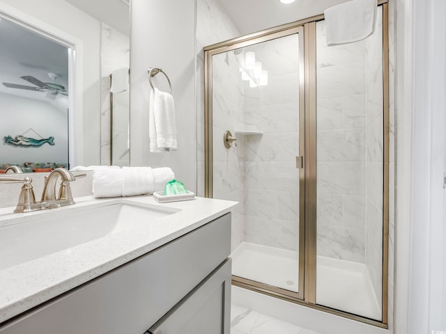 5205 Double Eagle Way Unit 24, North Myrtle Beach, SC 29582 - bathroom featuring vanity, a stall shower, ceiling fan, and marble look tiles