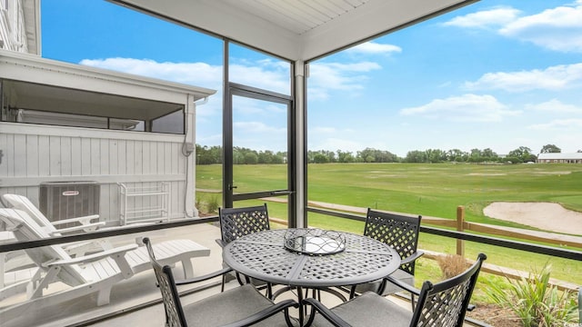 5205 Double Eagle Way Unit 24, North Myrtle Beach, SC 29582 - sunroom with view of golf course and outdoor dining space