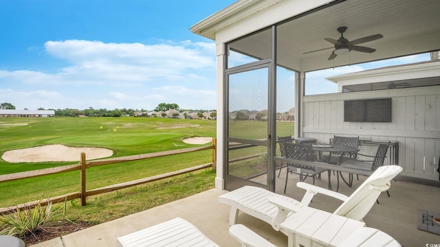 5205 Double Eagle Way Unit 24, North Myrtle Beach, SC 29582 - view of patio featuring ceiling fan, outdoor dining area, and a sunroom