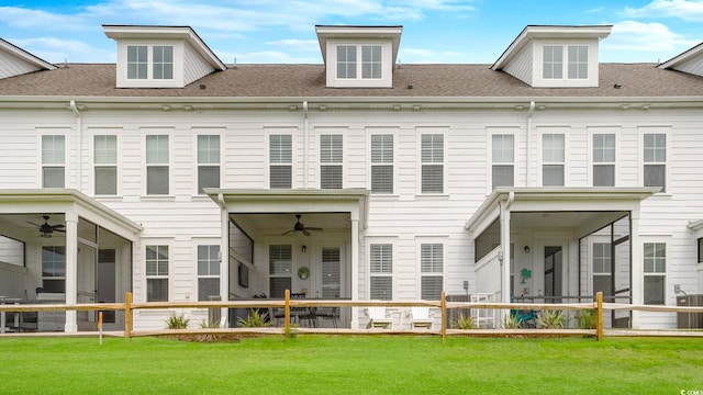 5205 Double Eagle Way Unit 24, North Myrtle Beach, SC 29582 - rear view of house with ceiling fan, a yard, and roof with shingles