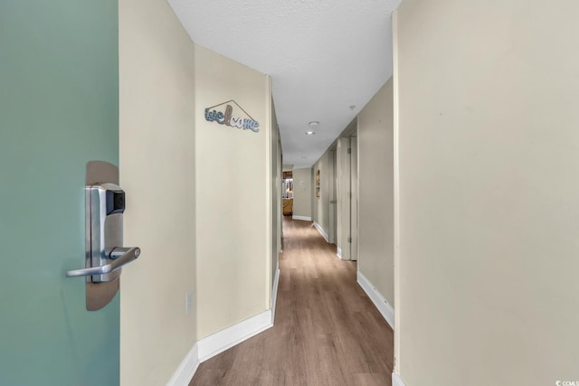 201 74th Ave N Unit 703, Myrtle Beach, SC 29572 - hallway featuring wood finished floors and baseboards