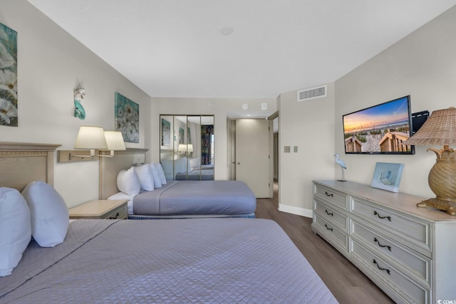201 74th Ave N Unit 703, Myrtle Beach, SC 29572 - bedroom featuring dark wood finished floors and baseboards