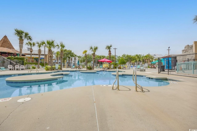 201 74th Ave N Unit 703, Myrtle Beach, SC 29572 - community pool featuring a patio area and a hot tub