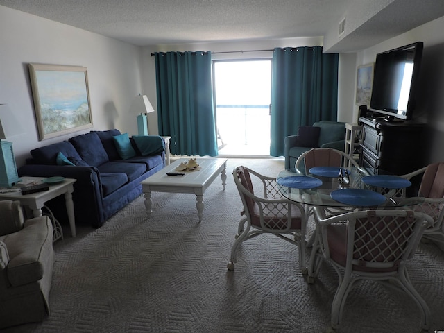 2500 N Ocean Blvd Unit 709, North Myrtle Beach, SC 29582 - carpeted living room featuring a textured ceiling