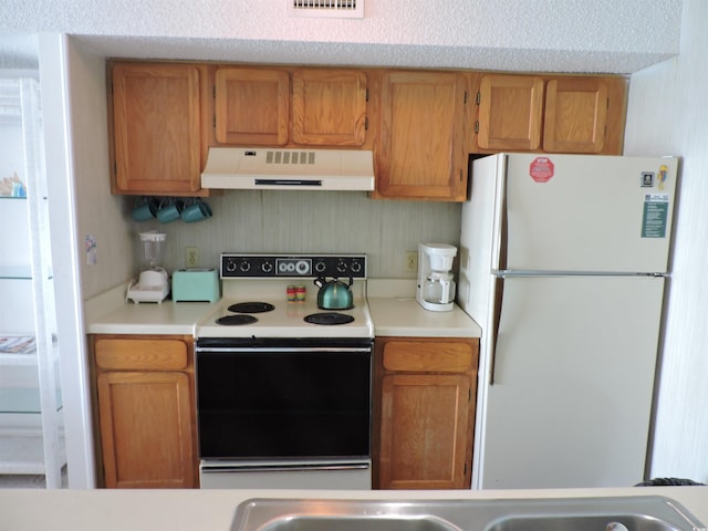 2500 N Ocean Blvd Unit 709, North Myrtle Beach, SC 29582 - kitchen featuring white appliances, custom exhaust hood, light countertops, and brown cabinetry