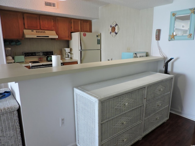 2500 N Ocean Blvd Unit 709, North Myrtle Beach, SC 29582 - kitchen featuring white appliances, extractor fan, light countertops, and a peninsula