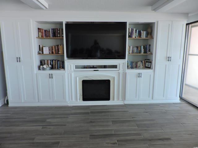 2500 N Ocean Blvd Unit 709, North Myrtle Beach, SC 29582 - unfurnished living room featuring wood finished floors and a premium fireplace