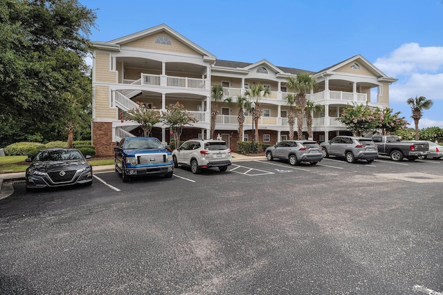 5801 Oyster Catcher Dr Unit 324, North Myrtle Beach, SC 29582 - view of building exterior with uncovered parking