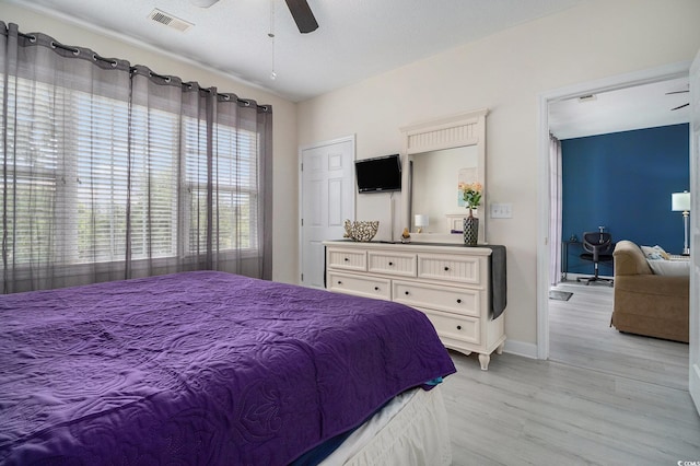 5801 Oyster Catcher Dr Unit 324, North Myrtle Beach, SC 29582 - bedroom featuring light wood-style floors and a ceiling fan