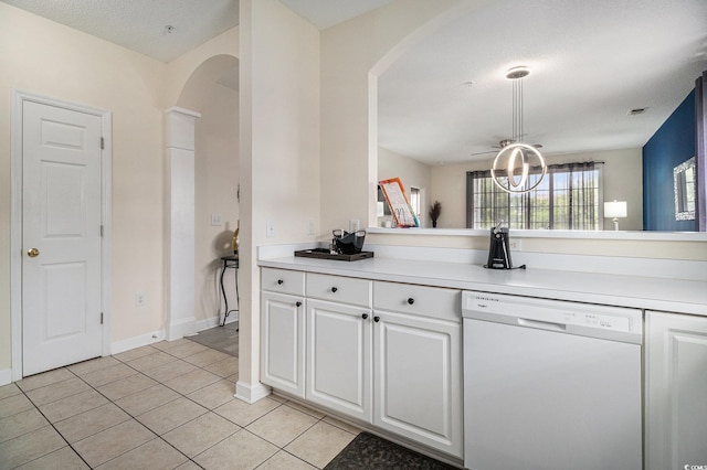 5801 Oyster Catcher Dr Unit 324, North Myrtle Beach, SC 29582 - kitchen featuring white dishwasher, arched walkways, white cabinets, and light tile patterned floors