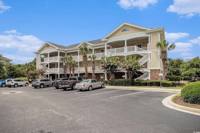 5801 Oyster Catcher Dr Unit 324, North Myrtle Beach, SC 29582 - view of property featuring uncovered parking and stairs