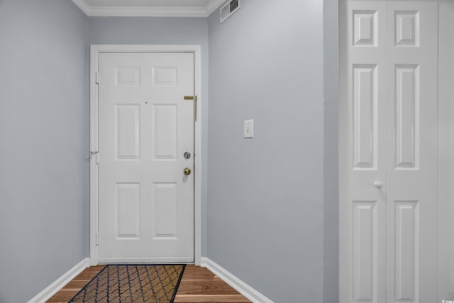 1100 Possum Trot Rd Unit E238, North Myrtle Beach, SC 29582 - doorway to outside with dark wood-type flooring and ornamental molding