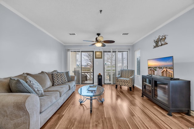 1100 Possum Trot Rd Unit E238, North Myrtle Beach, SC 29582 - living room featuring crown molding, a ceiling fan, and wood finished floors