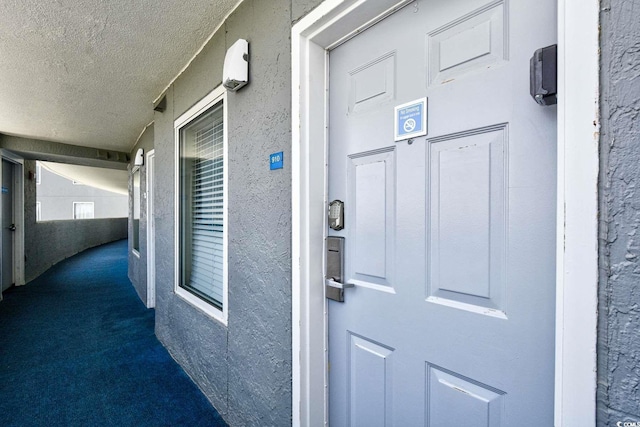 158 Seawatch Dr Unit 910, Myrtle Beach, SC 29572 - view of exterior entry featuring stucco siding