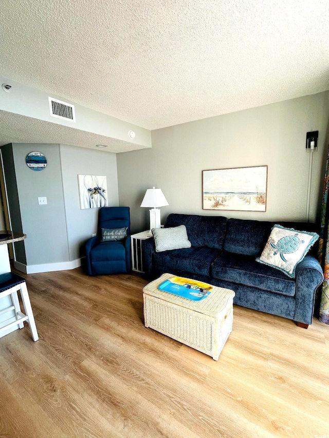 158 Seawatch Dr Unit 910, Myrtle Beach, SC 29572 - living room featuring wood finished floors and a textured ceiling